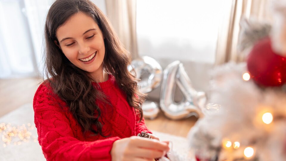 Woman decorating for Christmas