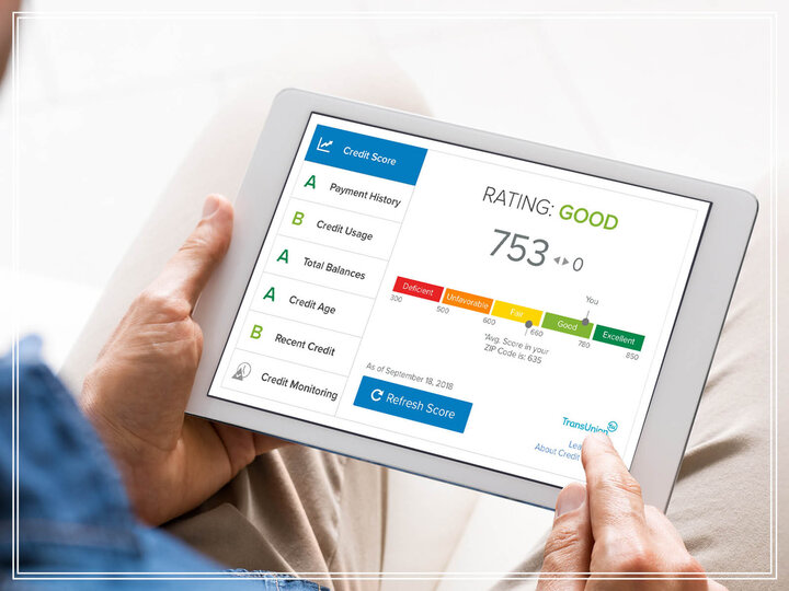 Tablet displaying a credit score rating of 753, marked "Good," alongside credit monitoring details.